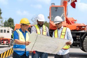 team-engineer-and-labor-worker-looking-at-blueprin-QNMVPNN.jpg